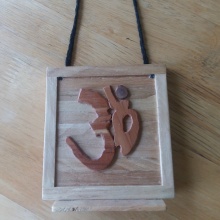 Inmate Andy M. —from Ohio—made this wooden OM plaque from Popsicle sticks and wood.